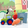Load image into Gallery viewer, Joyful Jellybean Farmyard themed toys including a baby toy tractor, baby toy carrot, baby toy rooster, baby toy cow and baby toy farm activity book