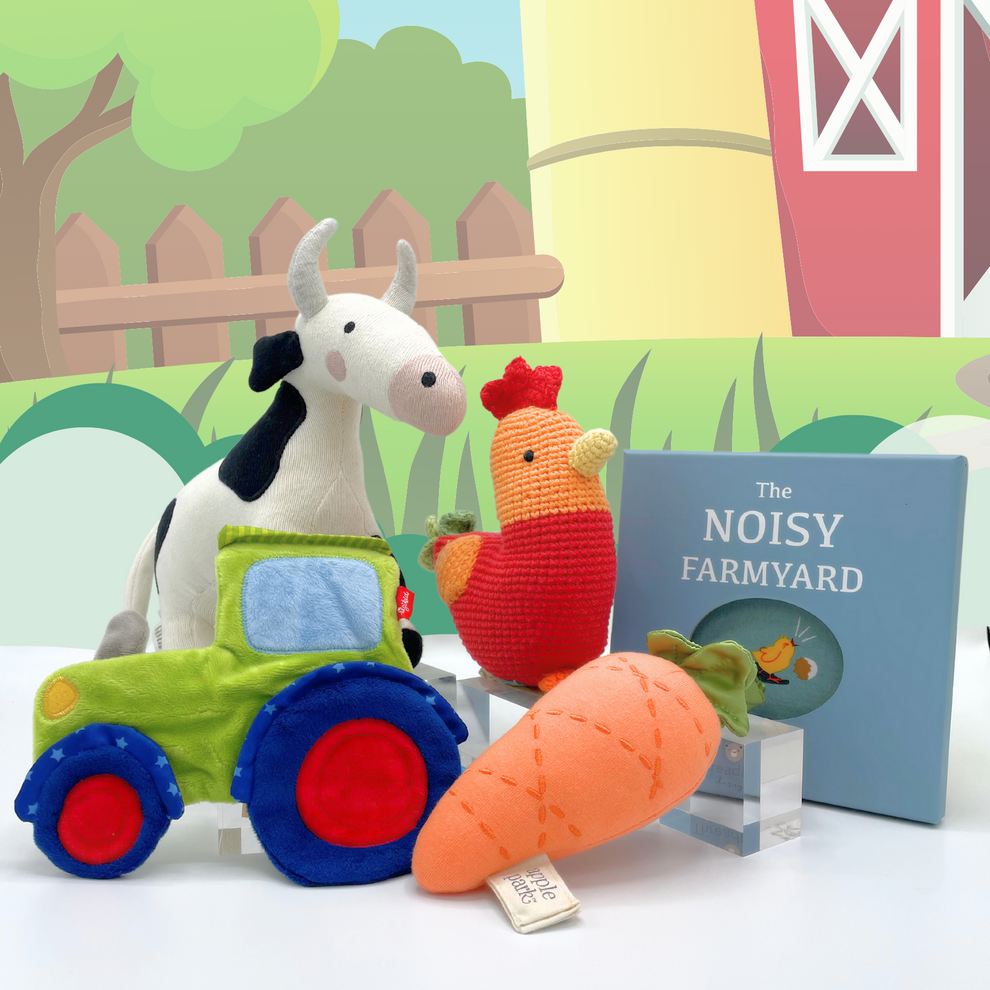 Joyful Jellybean Farmyard themed toys including a baby toy tractor, baby toy carrot, baby toy rooster, baby toy cow and baby toy farm activity book