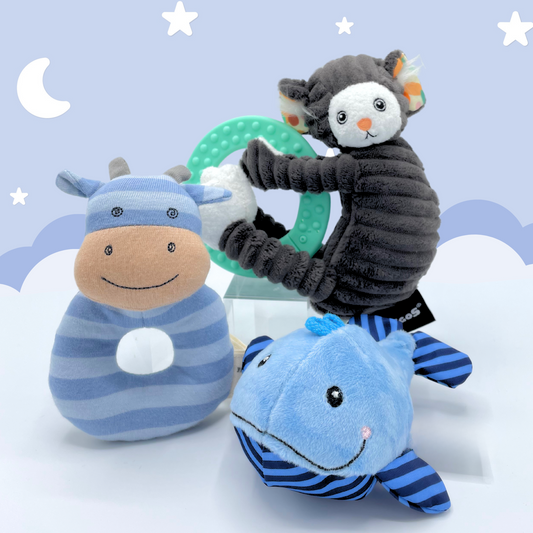 Joyful Jellybean Indigo Blue themed toys including a baby toy cow rattle, baby toy whale maraca and baby toy marmoset monkey teether